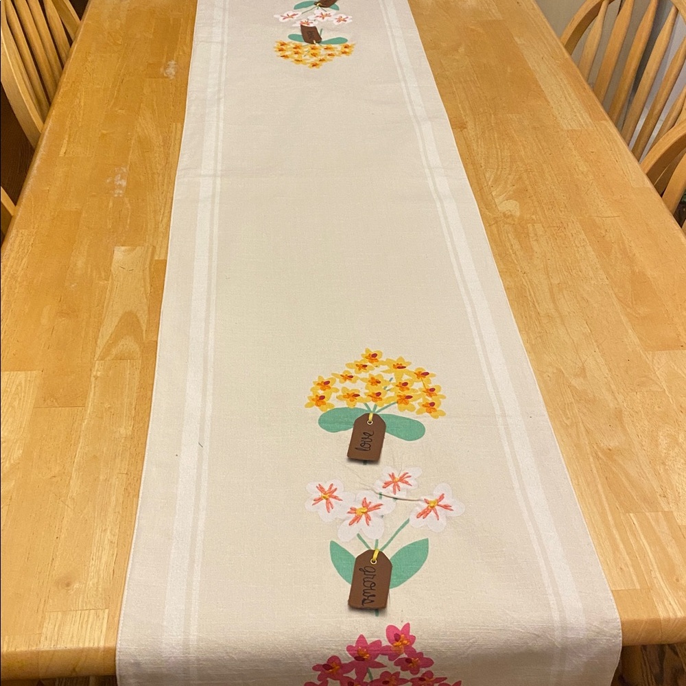 Floral Printed Table Runner w tags that say Love grows here & embroided flowers
